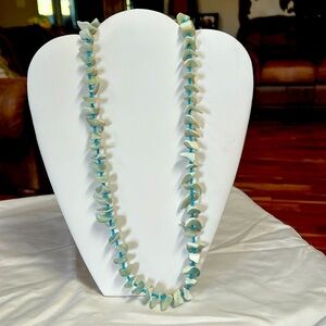 Great for a summer vacation.  24”  aqua and white chips